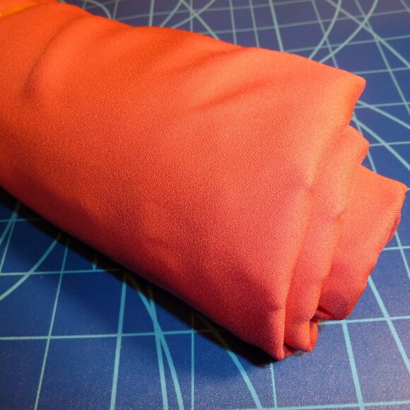 Luxurious fabric made from silk, cotton, nylon, and rayon in solid coral pink - Picture 2 of 2